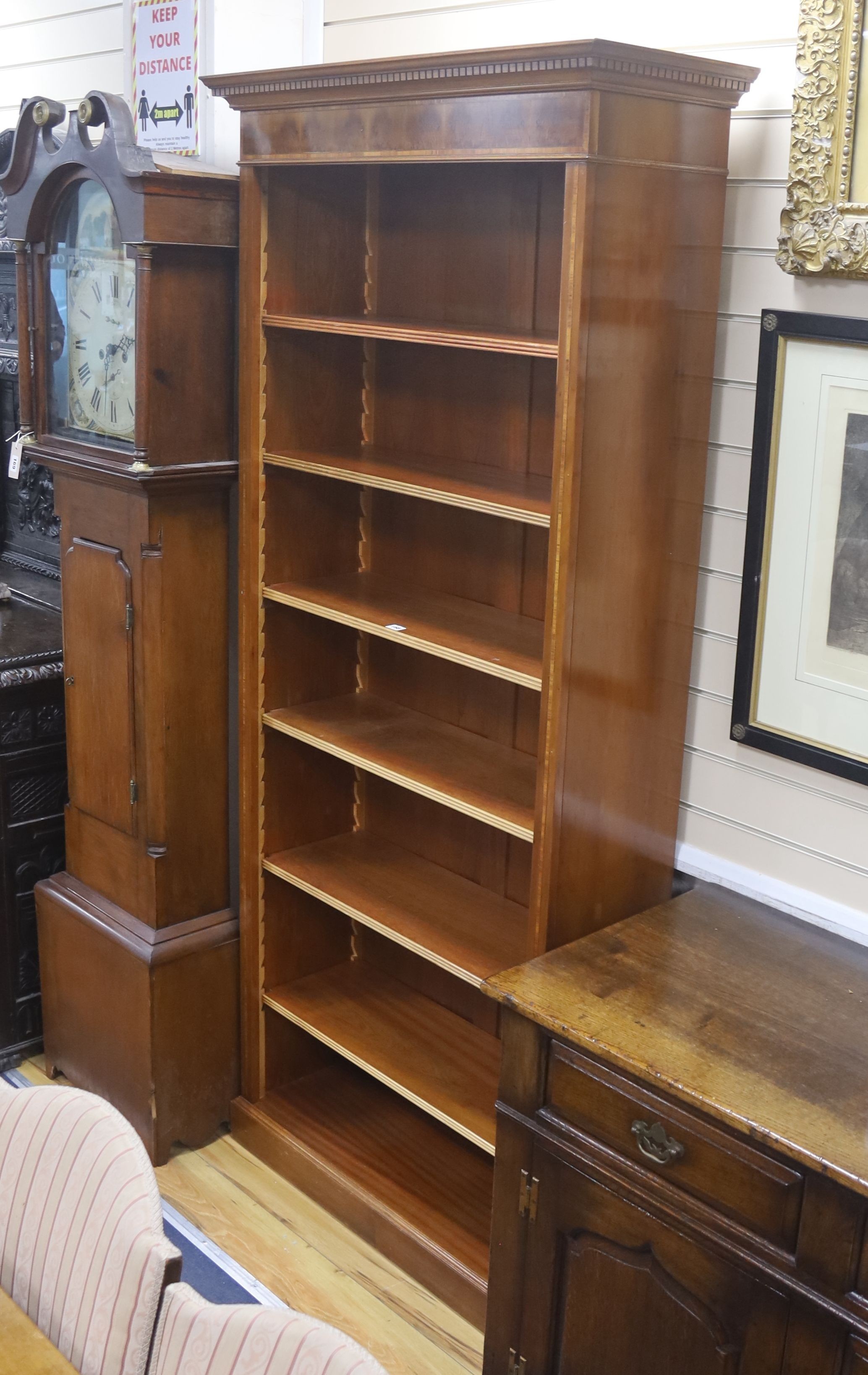 A reproduction satinwood banded yew open bookcase, length 92cm, depth 36cm, height 210cm